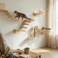 Load image into Gallery viewer, Modular wooden cat climbing wall system featuring a suspension bridge, a 4-step ladder, a scratching post, a curved balcony shelf, and a round plush beige cat bed.