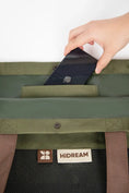 Load image into Gallery viewer, Close-up showing the secure opening and durable interior of the cat travel tote.