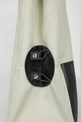 Load image into Gallery viewer, Close-up of the secure metallic snap closure on the premium cat carrier bag.