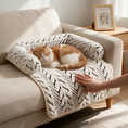Load image into Gallery viewer, Orange cat relaxing on The Sumi Lounger cat bed for couch while its owner strokes it
