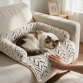Load image into Gallery viewer, Fluffy cat resting on The Sumi Lounger couch protector cat bed on a beige sofa
