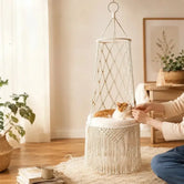 owner-petting-cat-in-boho-fringe-macrame-hanging-cat-bed