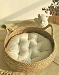 Load image into Gallery viewer, Natural Woven Cat Ear Bed in cattail, top-side view of the ear handles and cushion, rustic & natural cat furniture.
