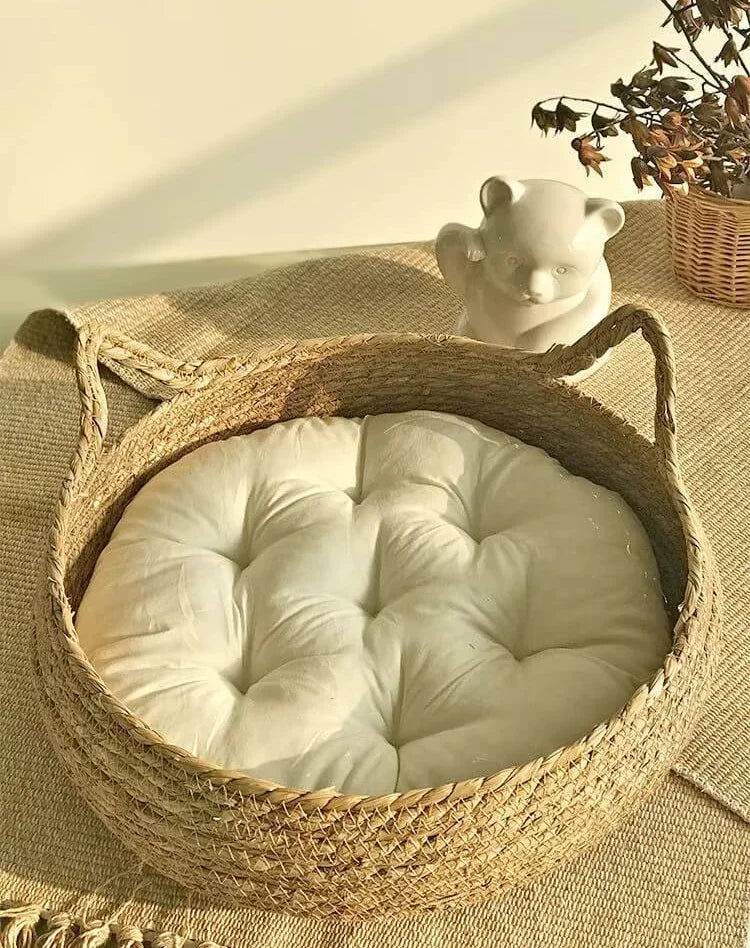 Natural Woven Cat Ear Bed in cattail, top-side view of the ear handles and cushion, rustic & natural cat furniture.