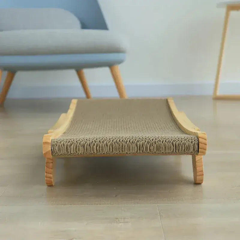 Cat happily resting on flat lounge mode of MeowShelf Trio wooden scratcher.