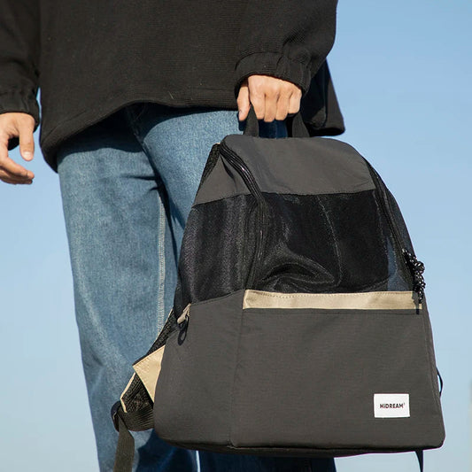 Owner wearing aesthetic Scandinavian MeowShelf Roamer cat travel backpack.