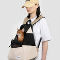 Load image into Gallery viewer, Cat looking out from well-ventilated MeowShelf Roamer soft-sided carrier.
