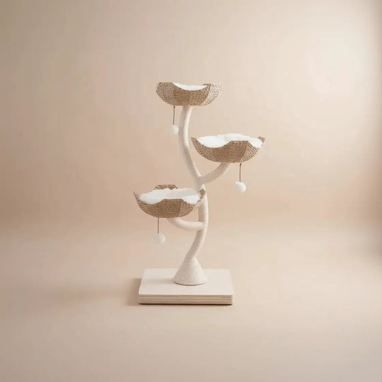 Style & Vibe category card featuring an aesthetic, tree-branch shaped cat tower with woven basket perches and white cushions.