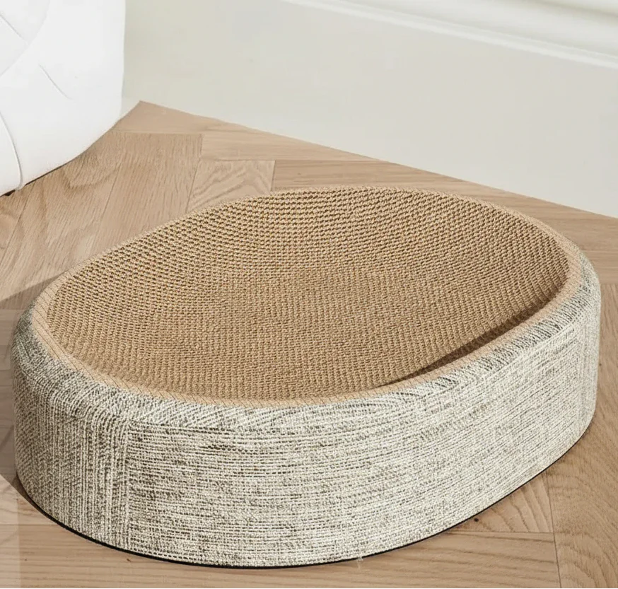 Zen Oval Woven Sisal Cat Scratcher, angled top view of the low-profile design, minimalist pet furniture.