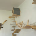Load and play video in Gallery viewer, Cat climbing and exploring a wall-mounted cat shelf system with a wooden cat house, a rope bridge, stepped platforms and a hammock shelf.
