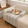 Load image into Gallery viewer, Orange and white cat curled up in The Sumi Lounger raised bolster cat bed on an armchair
