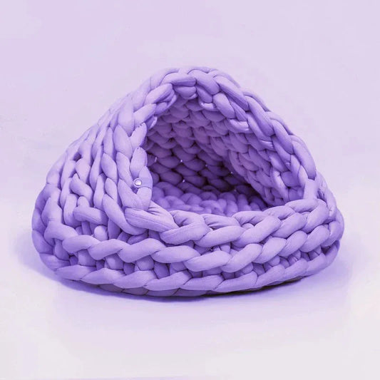 Chunky Knit Cocoon Cat Cave in ultra-thick hand-woven yarn, lower angled view of the plush layered opening, a soft cat bed.