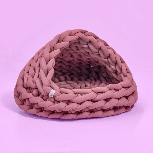 Chunky Knit Cocoon Cat Cave in ultra-thick hand-woven yarn, lower rear side view of the plush arching knit edge, a durable pet furniture piece.