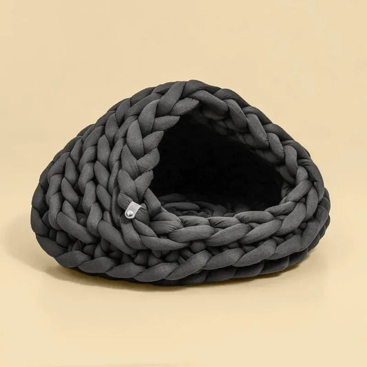 Chunky Knit Cocoon Cat Cave in ultra-thick hand-woven yarn, lower angled front view of the soft circular knit structure.