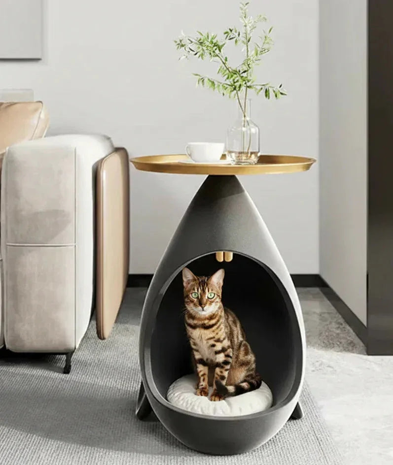 Concrete Loop Pebble Cat Cave in modern pebble and gold, interior cave shot of modern luxury side table, a cozy cat cave, modern and sleek.