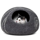 Cat inside Merino Cocoon dark grey wool felt cave — cozy felted cat hideaway, luxury cat bed