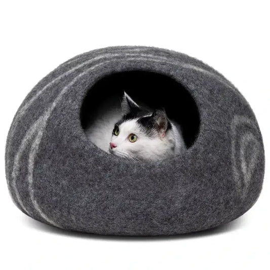 Cat inside Merino Cocoon dark grey wool felt cave — cozy felted cat hideaway, luxury cat bed
