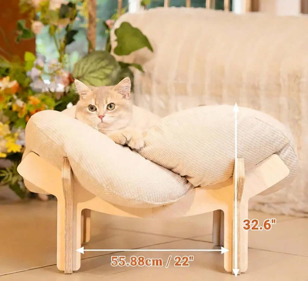 Nimbus elevated cat bed stand close-up — solid wood cross base, raises cat off cold floors