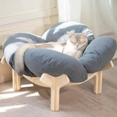 cat-resting-in-steel-blue-elevated-lounge-cat-bed-wood-stand