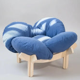 navy-blue-fluffy-cloud-cat-bed-on-natural-wood-stand