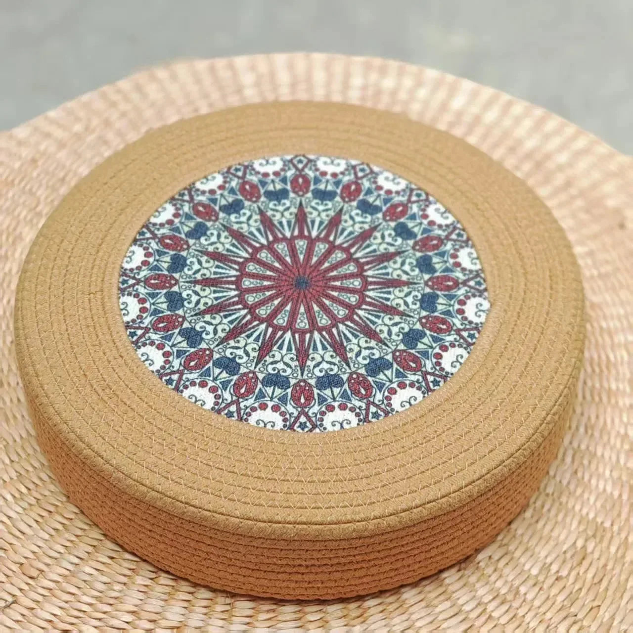 Tatami Zen Pouf in woven straw, close-up top detail of the kaleidoscope pattern, artistic pet furniture.