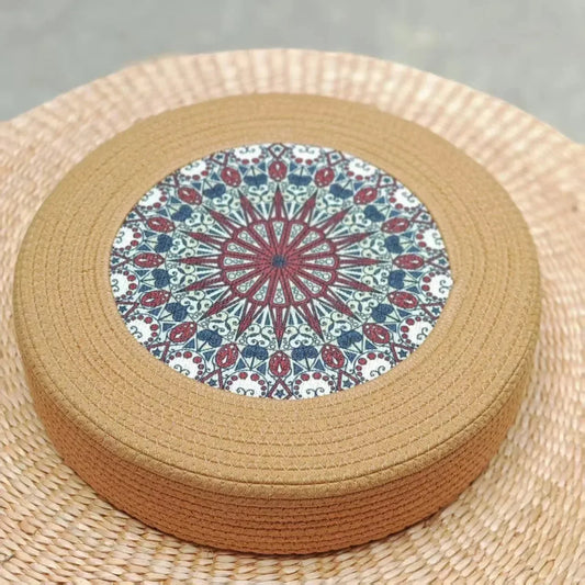 Tatami Zen Pouf in woven straw, close-up top detail of the kaleidoscope pattern, artistic pet furniture.