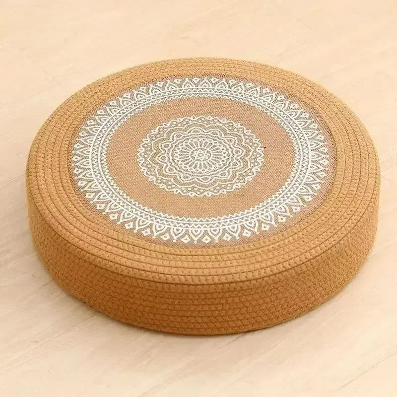 Tatami Zen Pouf in woven straw, close-up side view of the detailed mandala embroidery craftsmanship.