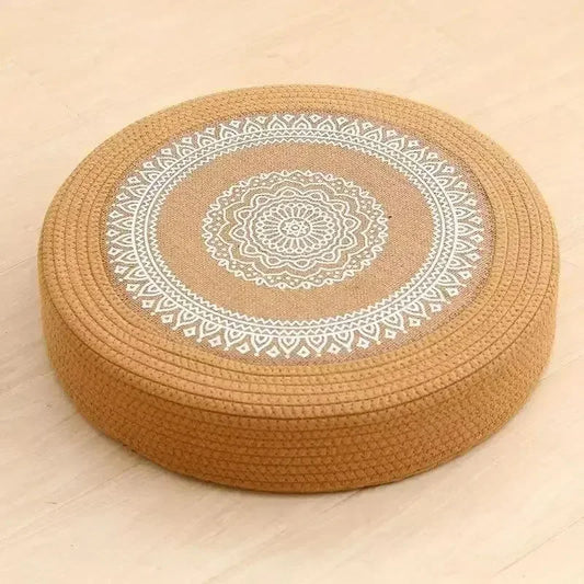 Tatami Zen Pouf in woven straw, close-up side view of the detailed mandala embroidery craftsmanship.